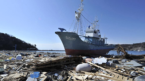 Whaling ship taisho maru no 28 amongst beached debris following Japan's 2011 earthquake and tsunami